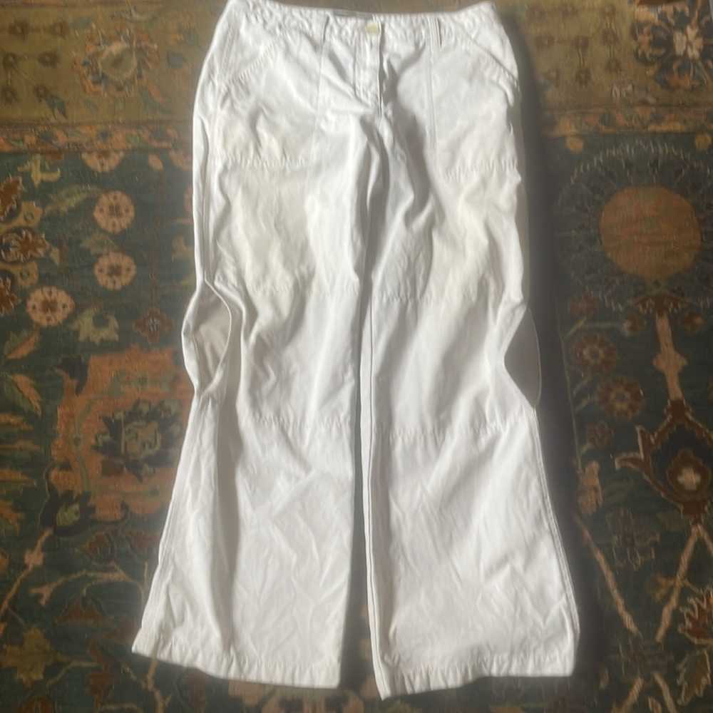 Tomboy off white canvas work pants with openings for knee pads.